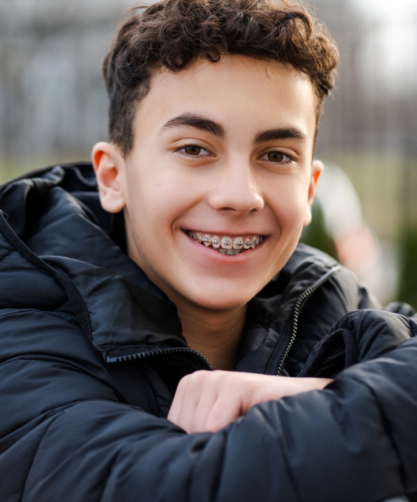 Teen patient smiling with braces