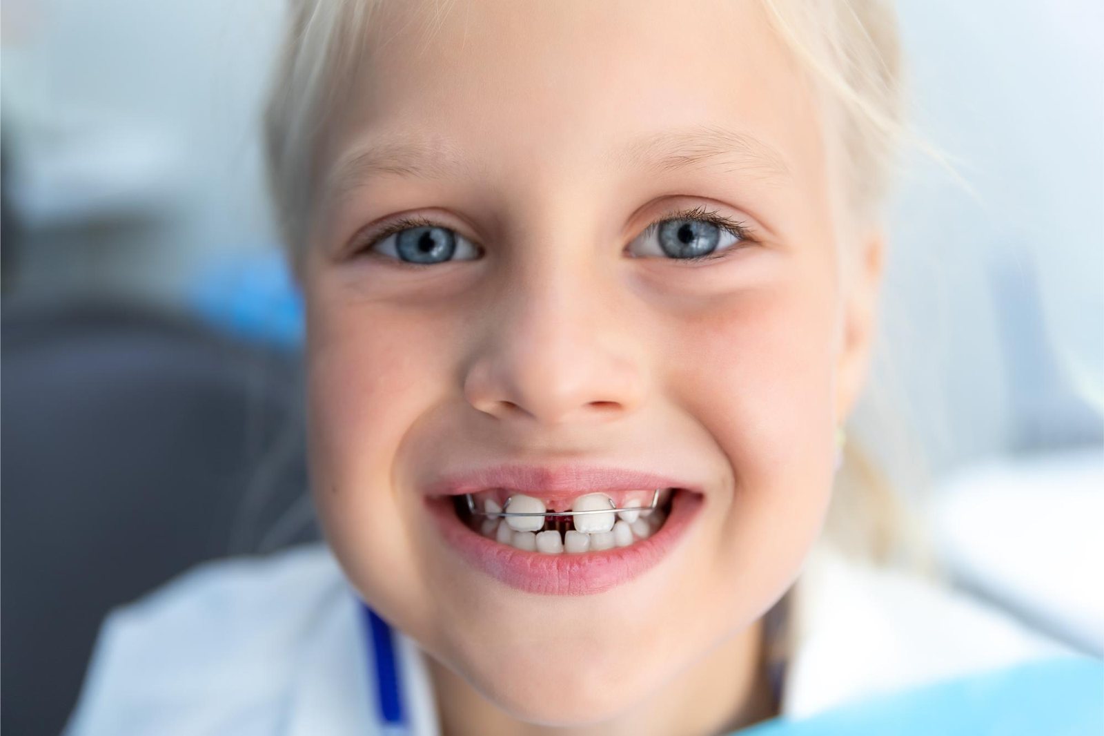 Child smiling at her first orthodontic evaluation