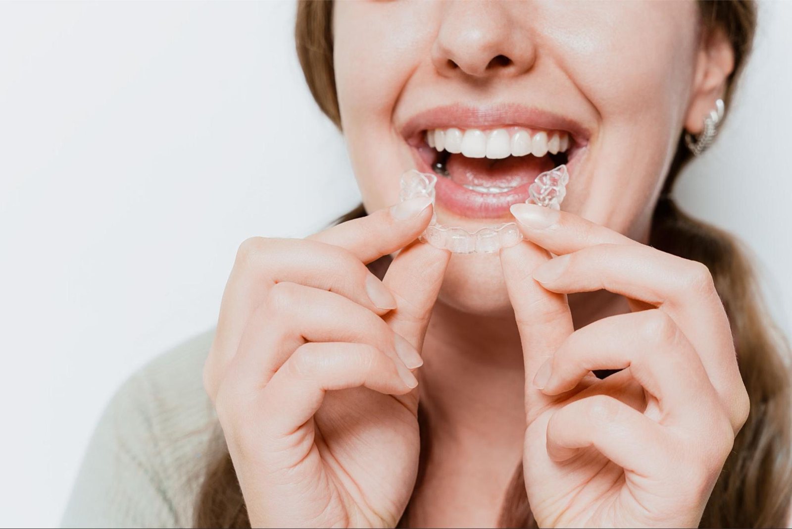 Patient placing a clear aligner