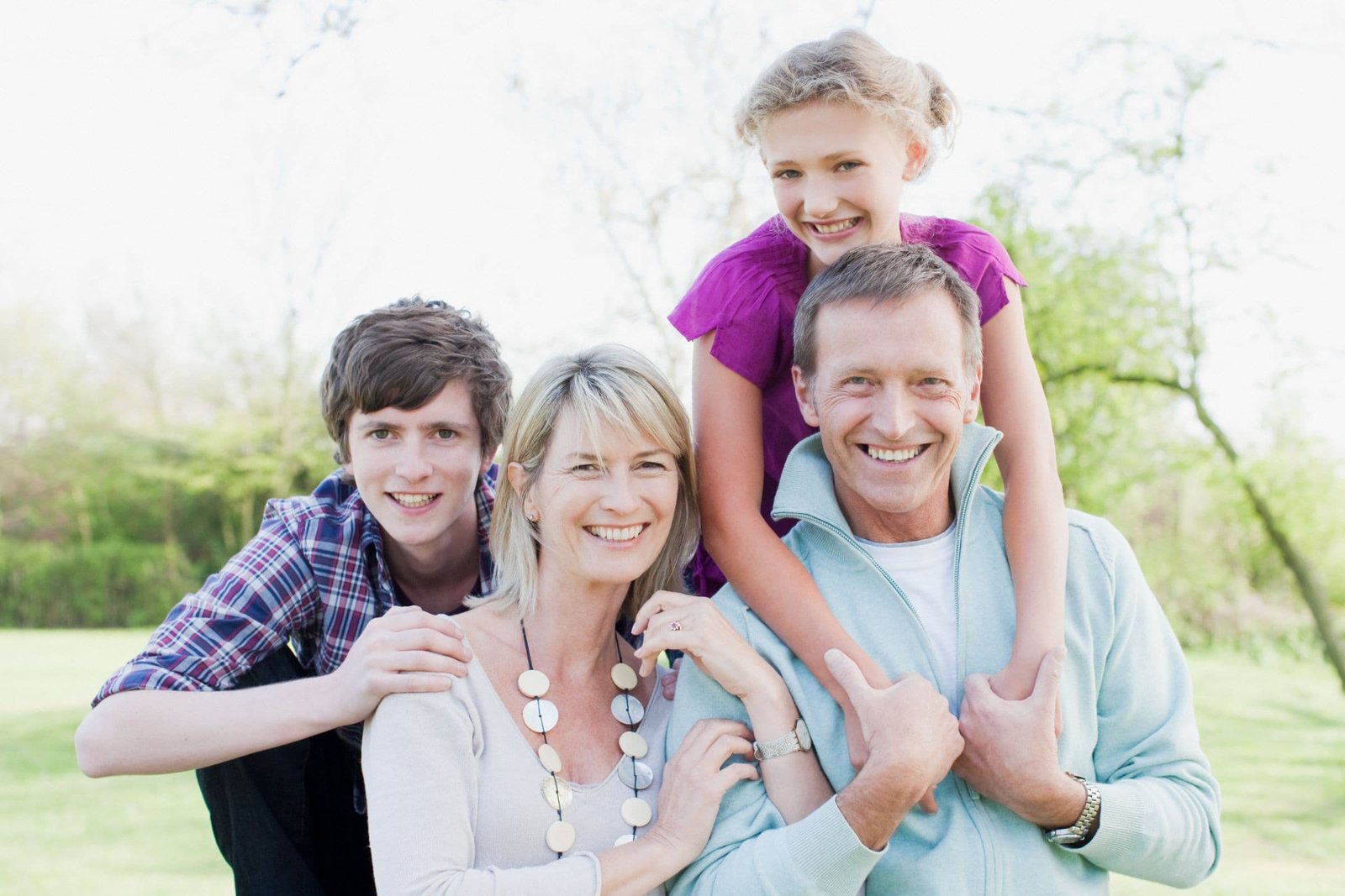 Local Kentucky family smiling outdoors