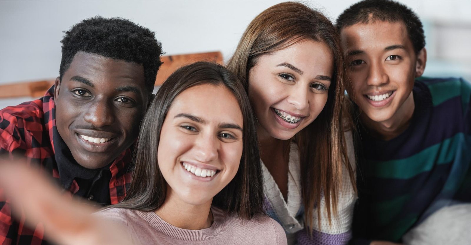 Teens smiling with metal braces