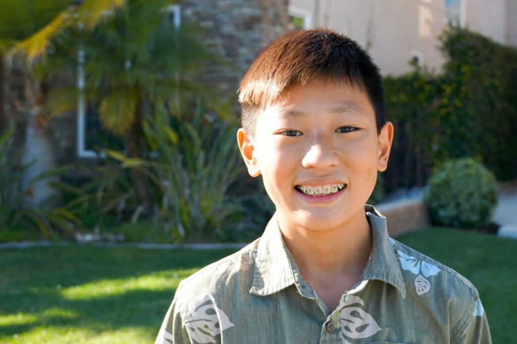 Smiling boy outdoors in the backyard