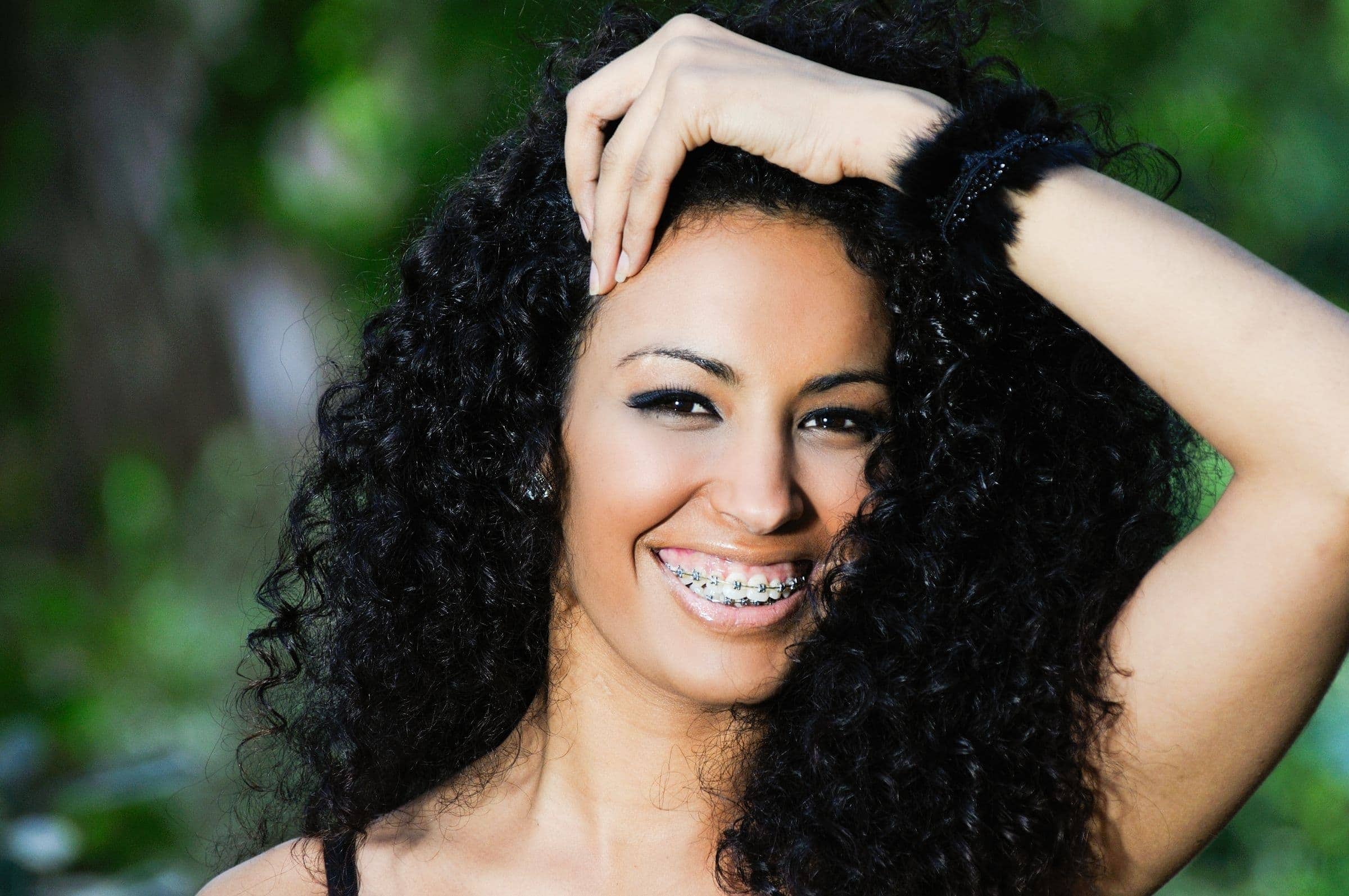 Adult woman smiling with braces